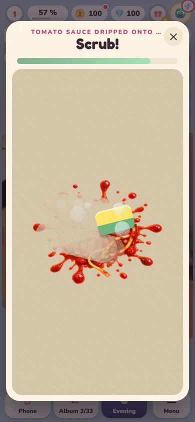 The "Scrub!" mini-game: a sponge wiping off a tomato sauce stain